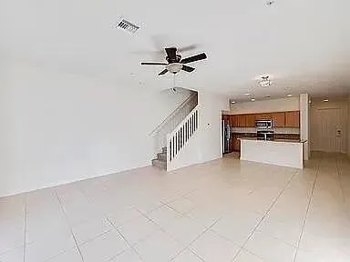 a view of a kitchen with a sink and cabinets