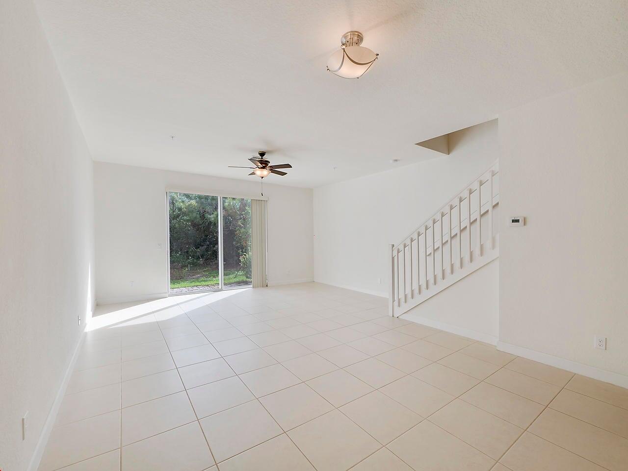 3047 Southwest Otter Lane Stuart, FL 34997 - Photo 6 of 12 a view of an empty room with a window