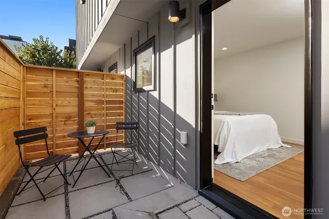 a balcony view with a outdoor seating