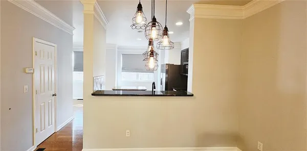 a view of a bathroom with a sink and mirror