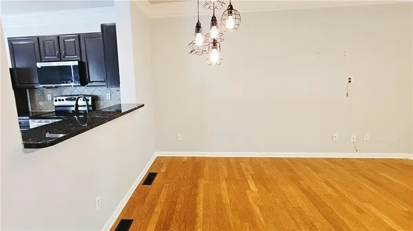 a bathroom with a sink and a microwave