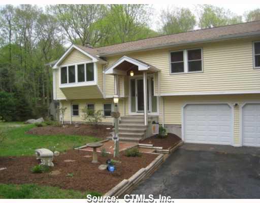 53 Winding Road Madison, CT 06443 - Photo 1 of 1 a front view of a house with garden