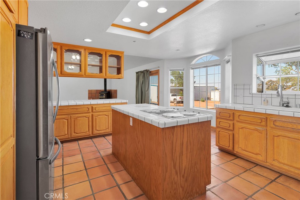 8381 White Road Phelan, CA 92371 - Photo 11 of 59 a kitchen with stainless steel appliances granite countertop a sink and cabinets