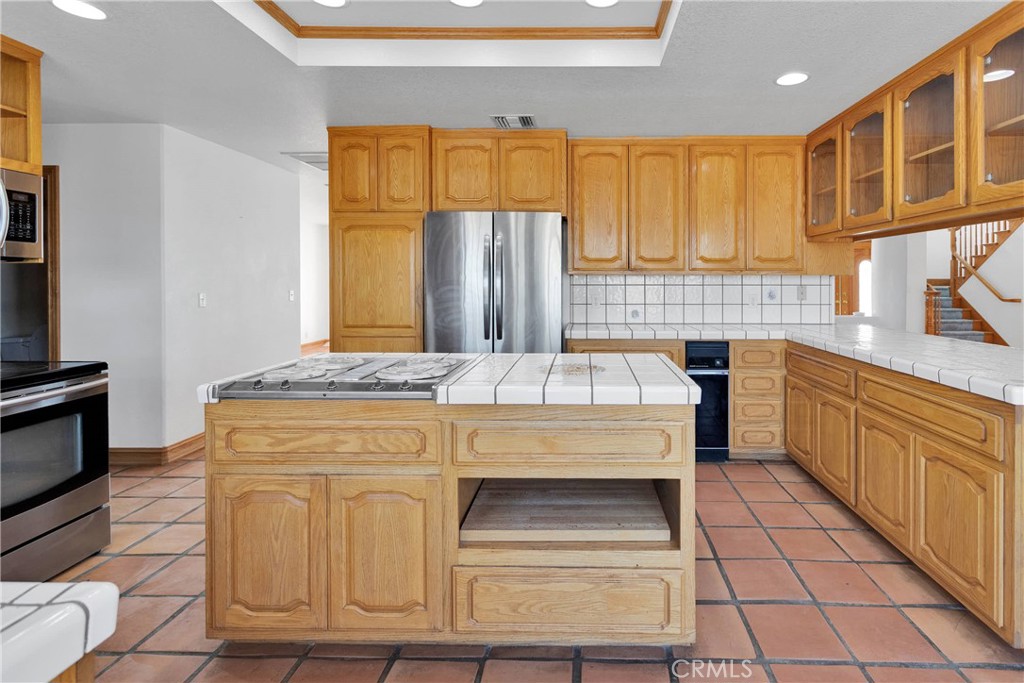 8381 White Road Phelan, CA 92371 - Photo 15 of 59 a kitchen with stainless steel appliances kitchen island granite countertop a granite counter tops and a window
