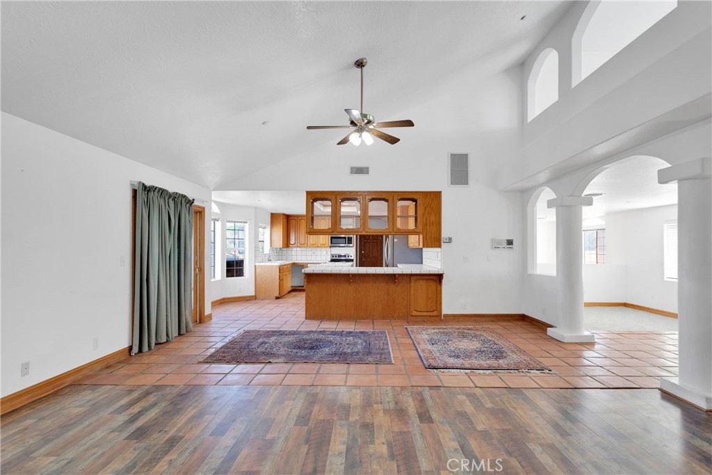 8381 White Road Phelan, CA 92371 - Photo 19 of 59 a view of a kitchen with a sink and a living room