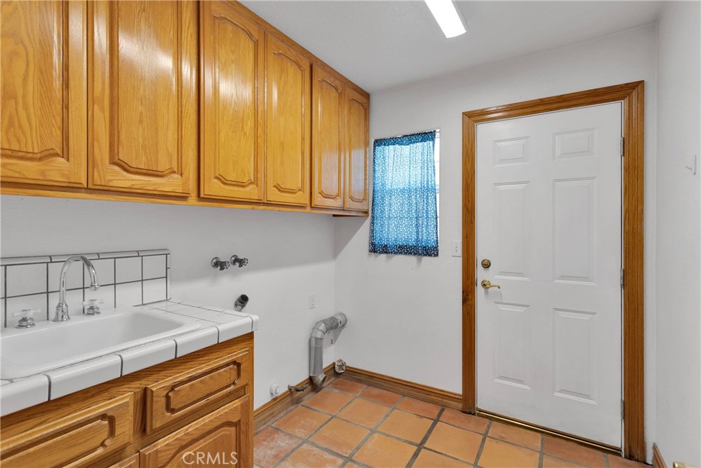 8381 White Road Phelan, CA 92371 - Photo 22 of 59 a kitchen with stainless steel appliances granite countertop a refrigerator and a sink