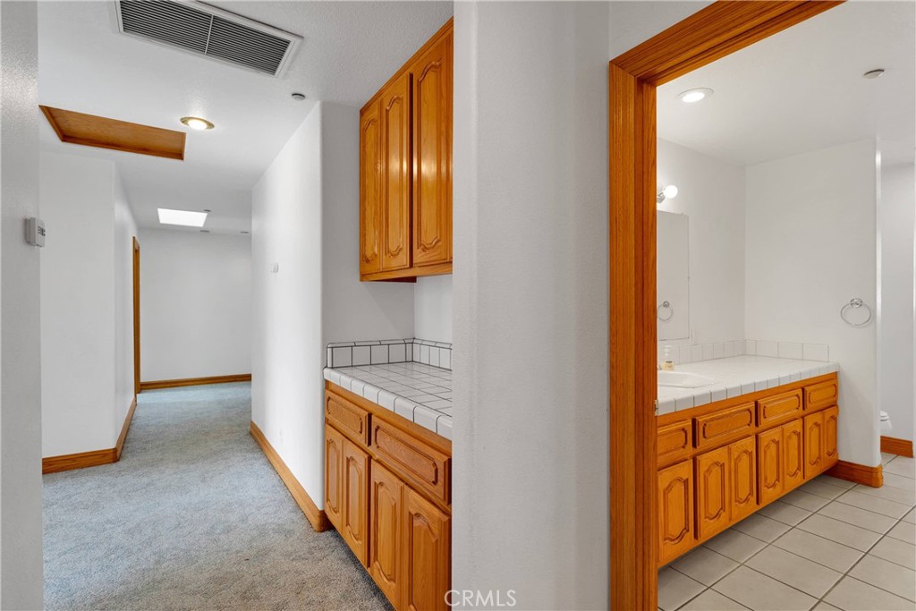 8381 White Road Phelan, CA 92371 - Photo 23 of 59 a view of a hallway with wooden floor and cabinet