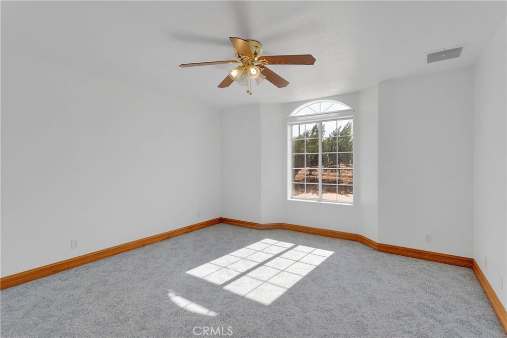 8381 White Road Phelan, CA 92371 - Photo 26 of 59 a view of an empty room with a window