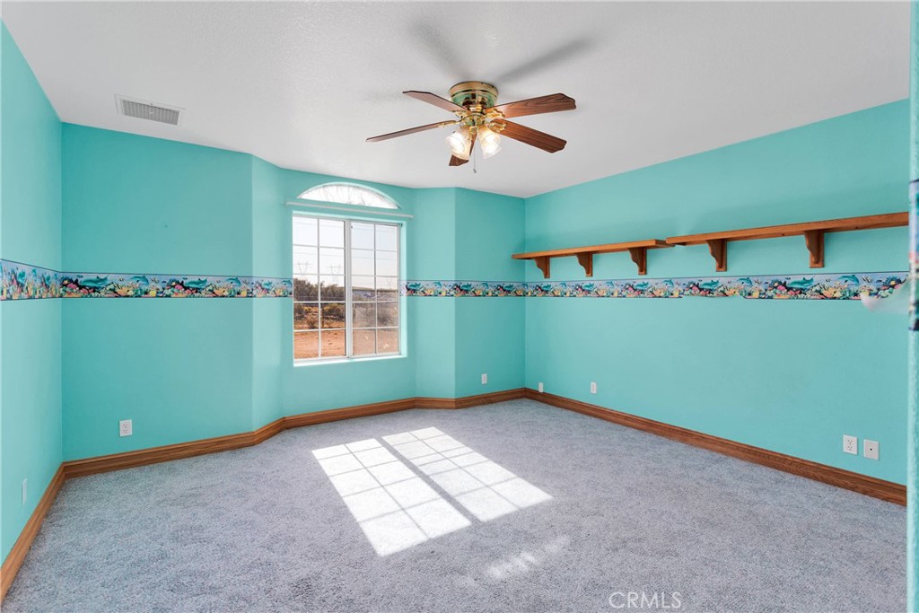 8381 White Road Phelan, CA 92371 - Photo 30 of 59 a view of an empty room with a window