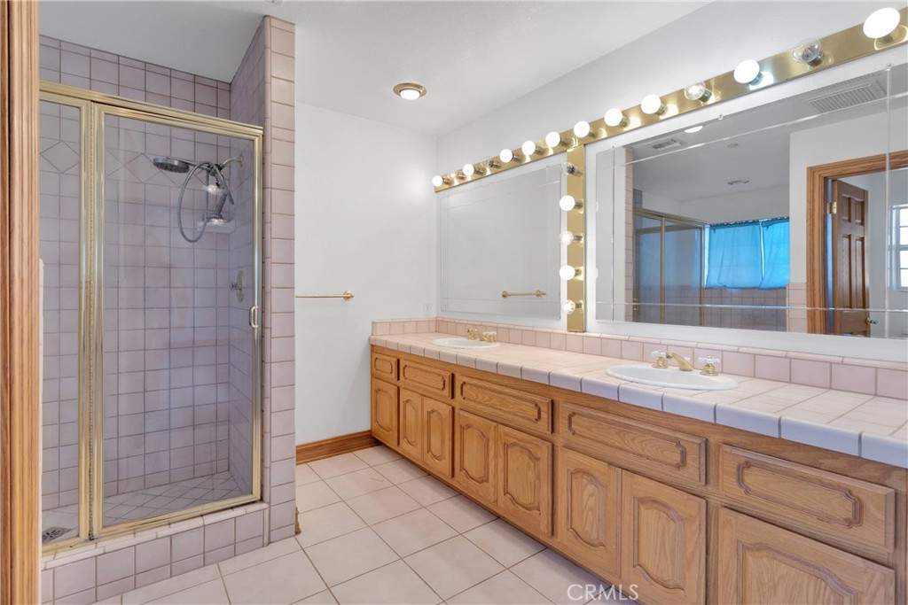 8381 White Road Phelan, CA 92371 - Photo 35 of 59 a spacious bathroom with double sink and a mirror