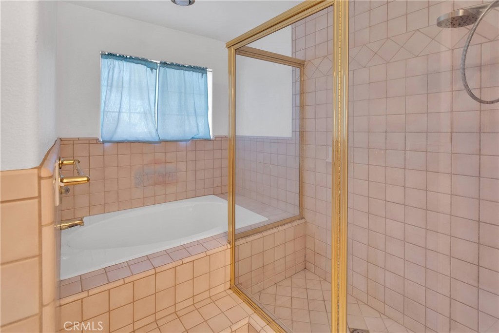 8381 White Road Phelan, CA 92371 - Photo 37 of 59 a bathroom with a bathtub and shower