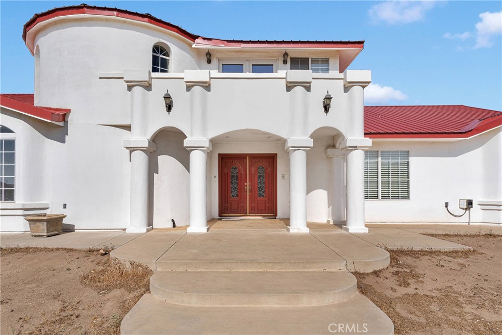 8381 White Road Phelan, CA 92371 - Photo 4 of 59 a front view of a house with large windows