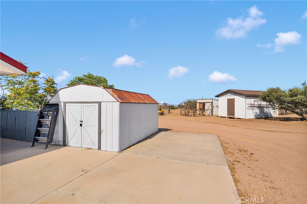 8381 White Road Phelan, CA 92371 - Photo 44 of 59 a view of a house with a snow in front of it
