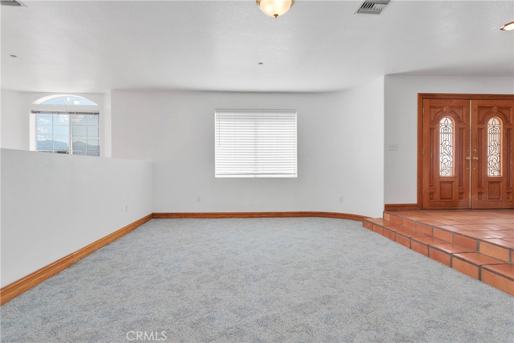 8381 White Road Phelan, CA 92371 - Photo 7 of 59 an empty room with a window
