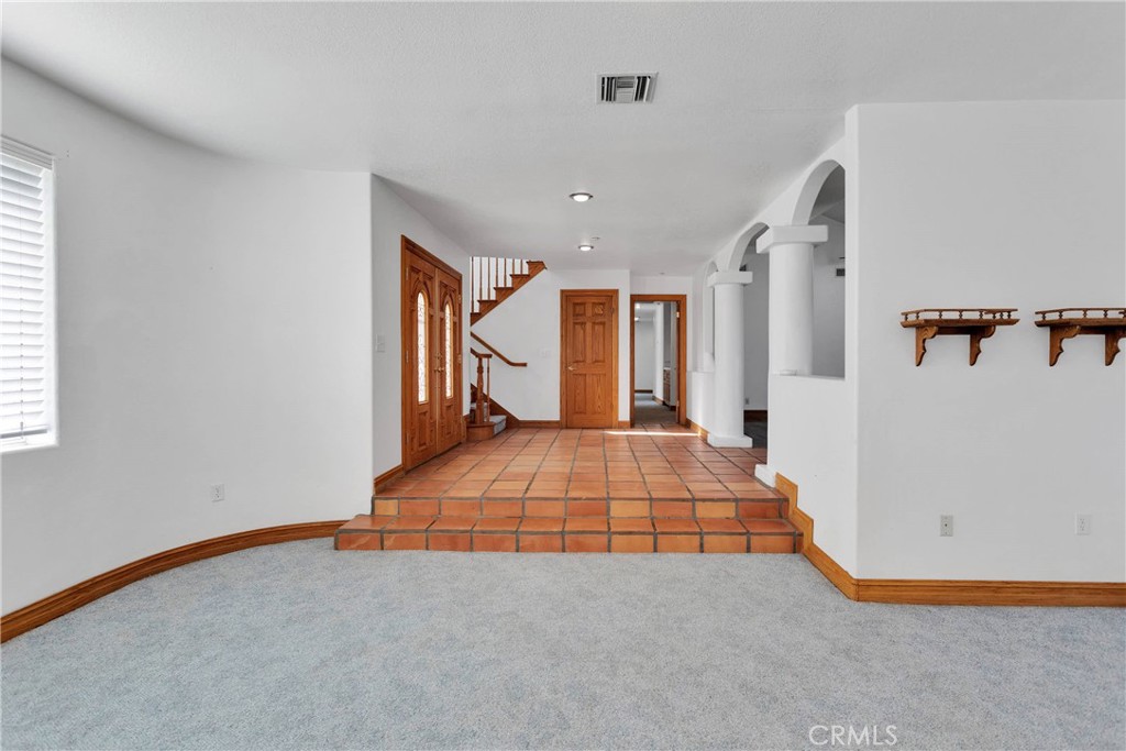 8381 White Road Phelan, CA 92371 - Photo 8 of 59 a spacious bedroom with a bed and a large window