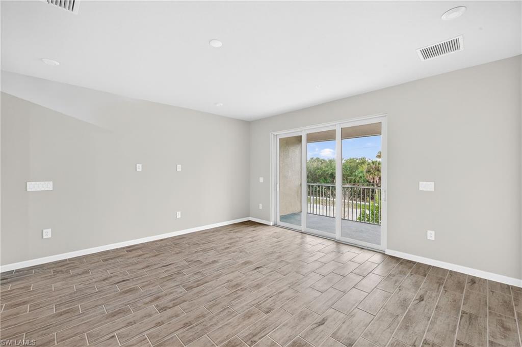 4646 Arboretum Circle, Unit 202 Naples, FL 34112 - Photo 10 of 25 Open Living Area