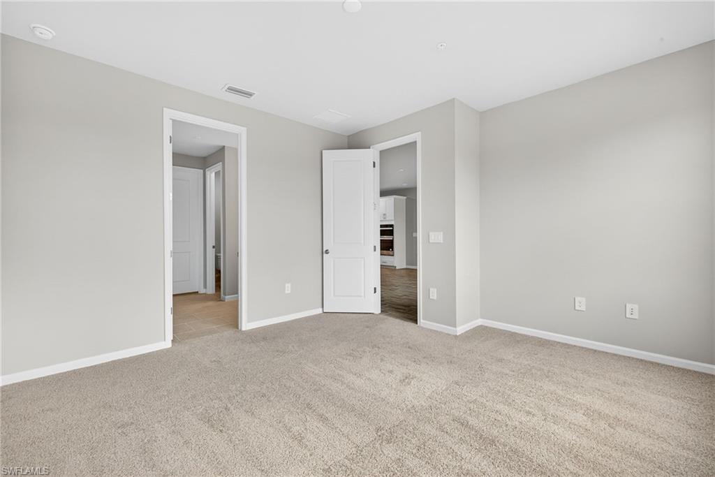 4646 Arboretum Circle, Unit 202 Naples, FL 34112 - Photo 14 of 25 Master Bedroom