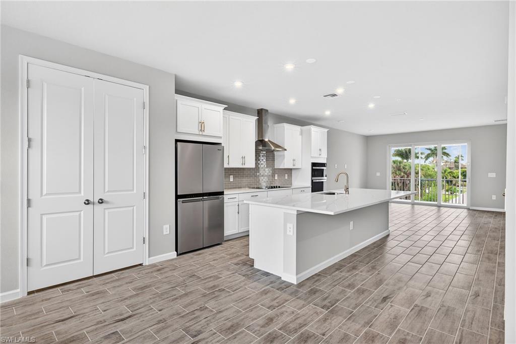 4646 Arboretum Circle, Unit 202 Naples, FL 34112 - Photo 2 of 25 Pantry next to Kitchen