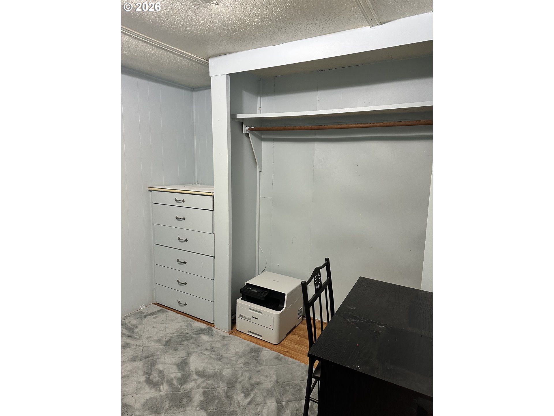 37635 Row River Road, Unit 7 Dorena, OR 97434 - Photo 23 of 27 a room with a chair and cabinets