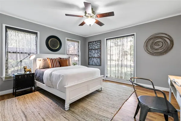 a bedroom with a bed and a chair