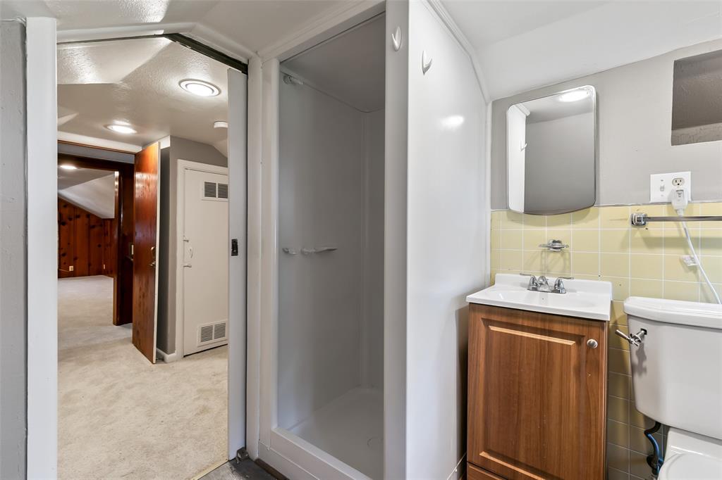 4206 Somerville Avenue Dallas, TX 75206 - Photo 18 of 26 a bathroom with a sink toilet and shower