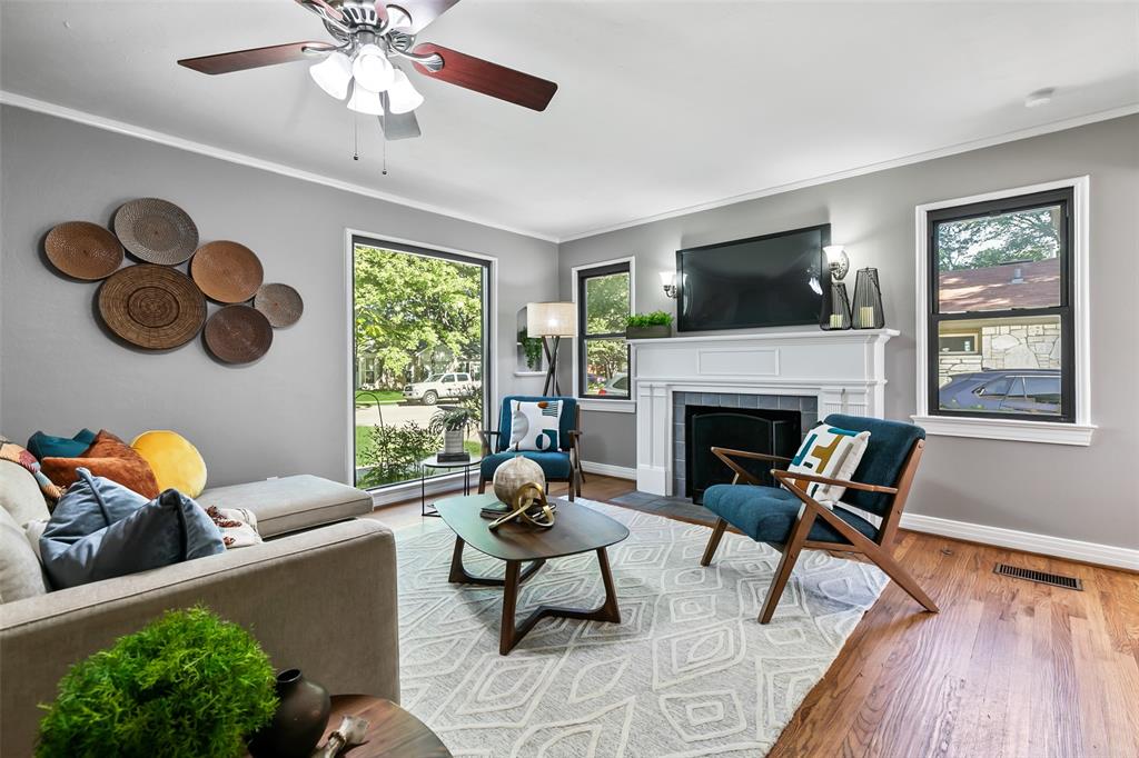 4206 Somerville Avenue Dallas, TX 75206 - Photo 2 of 26 a living room with furniture and a fireplace