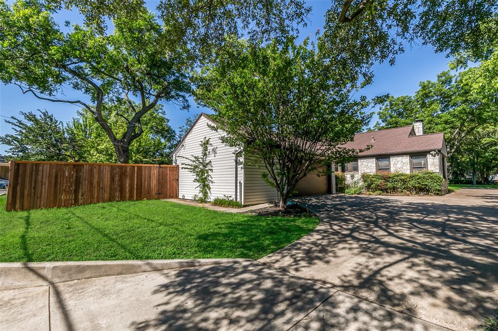 4206 Somerville Avenue Dallas, TX 75206 - Photo 24 of 26 a front view of a house with a garden
