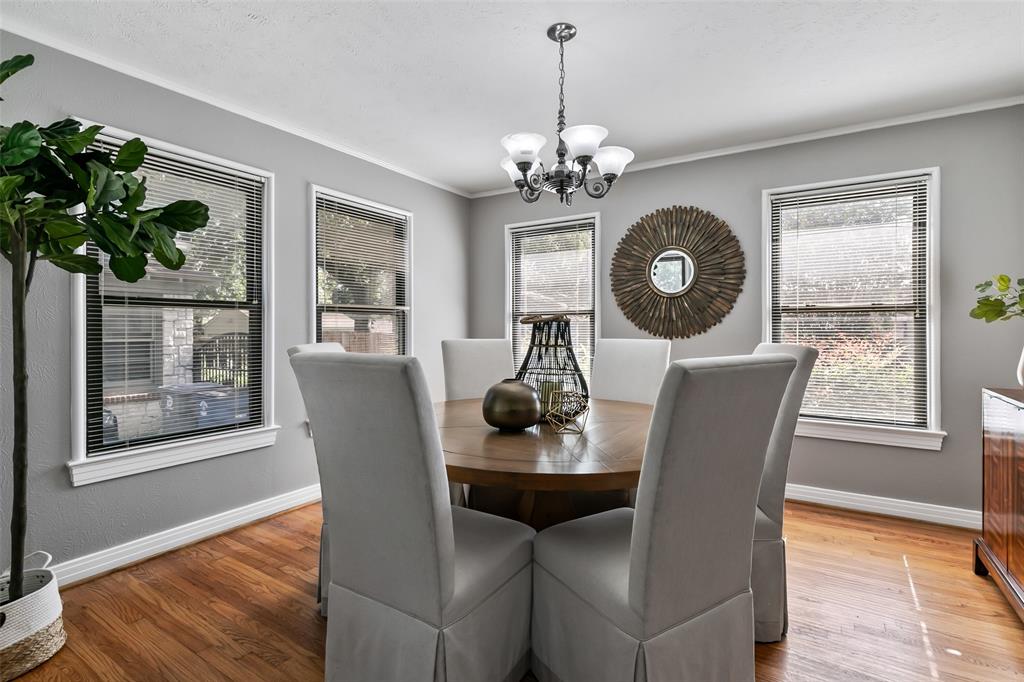 4206 Somerville Avenue Dallas, TX 75206 - Photo 4 of 26 a dining room with furniture potted plants and wooden floor