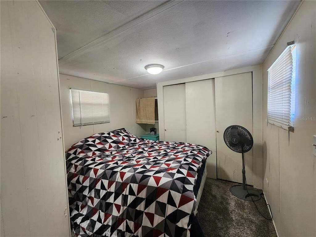 3074 Larkin Road Mims, FL 32754 - Photo 11 of 16 a bedroom with bed and a window