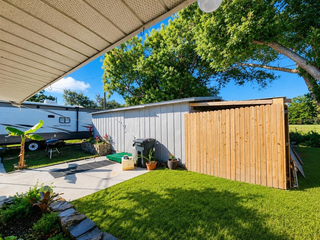 3074 Larkin Road Mims, FL 32754 - Photo 12 of 15 a view of a backyard with sitting area