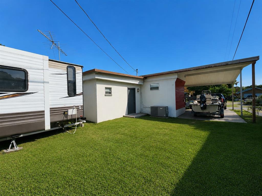3074 Larkin Road Mims, FL 32754 - Photo 14 of 15 a view of a backyard with furniture