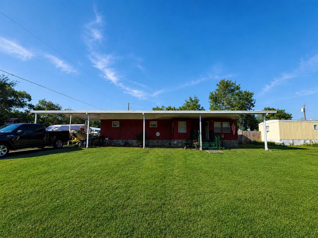 3074 Larkin Road Mims, FL 32754 - Photo 2 of 15 a view of a house with a yard