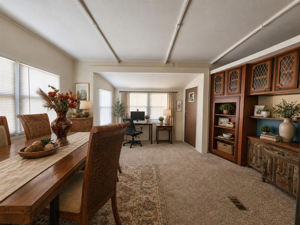 3074 Larkin Road Mims, FL 32754 - Photo 4 of 15 a living room with furniture a desk and closet