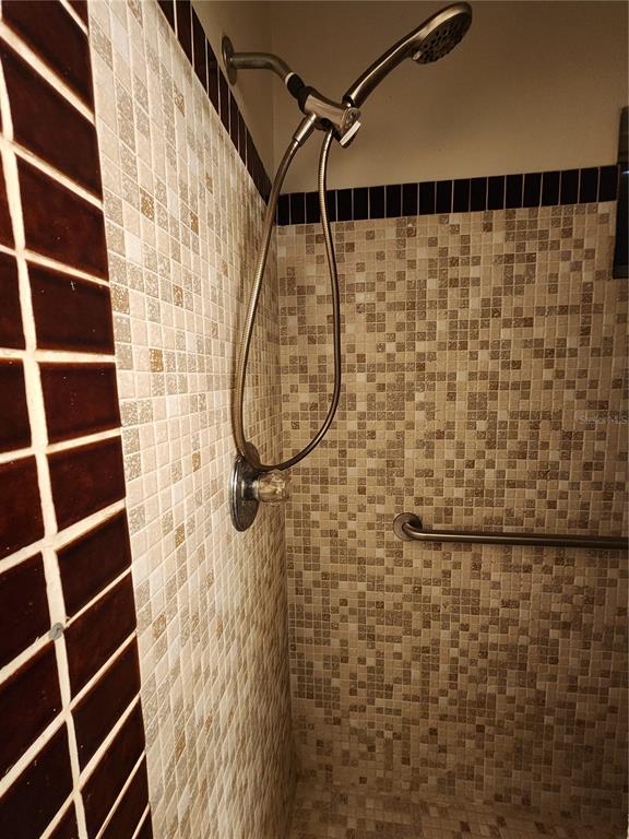 3074 Larkin Road Mims, FL 32754 - Photo 7 of 16 a bathroom with a shower