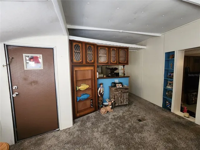 a bedroom with bed and a window