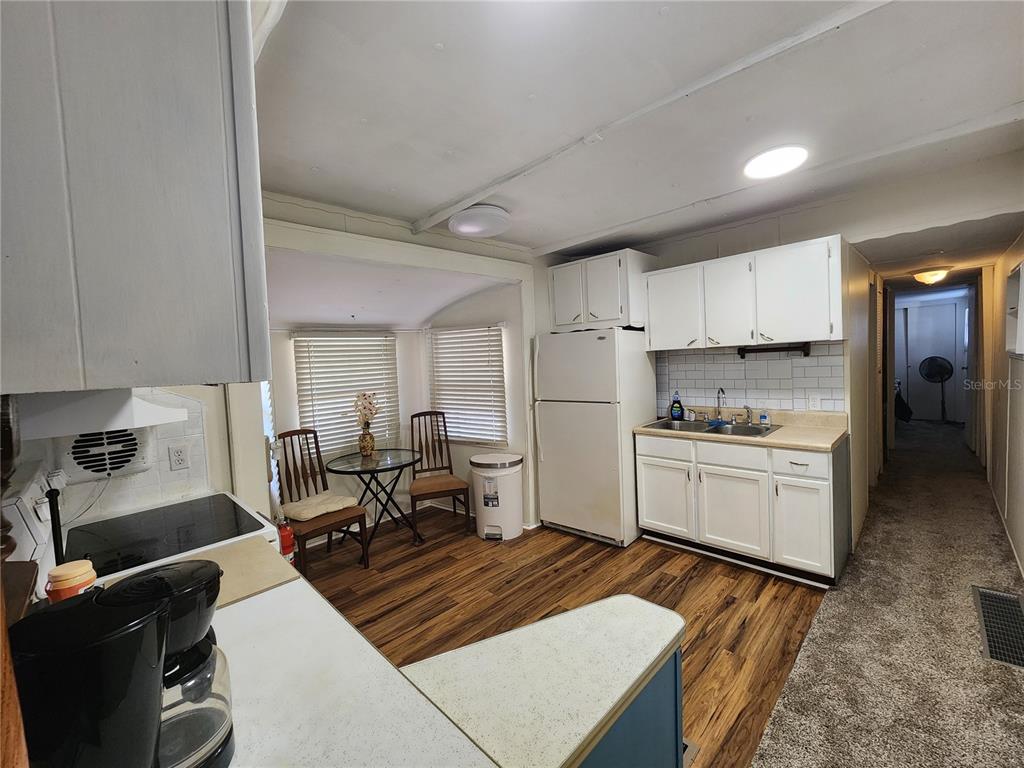 3074 Larkin Road Mims, FL 32754 - Photo 10 of 16 a kitchen with a sink stove and refrigerator