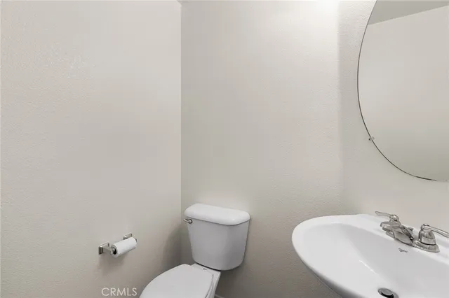 a view of a house with wooden fence