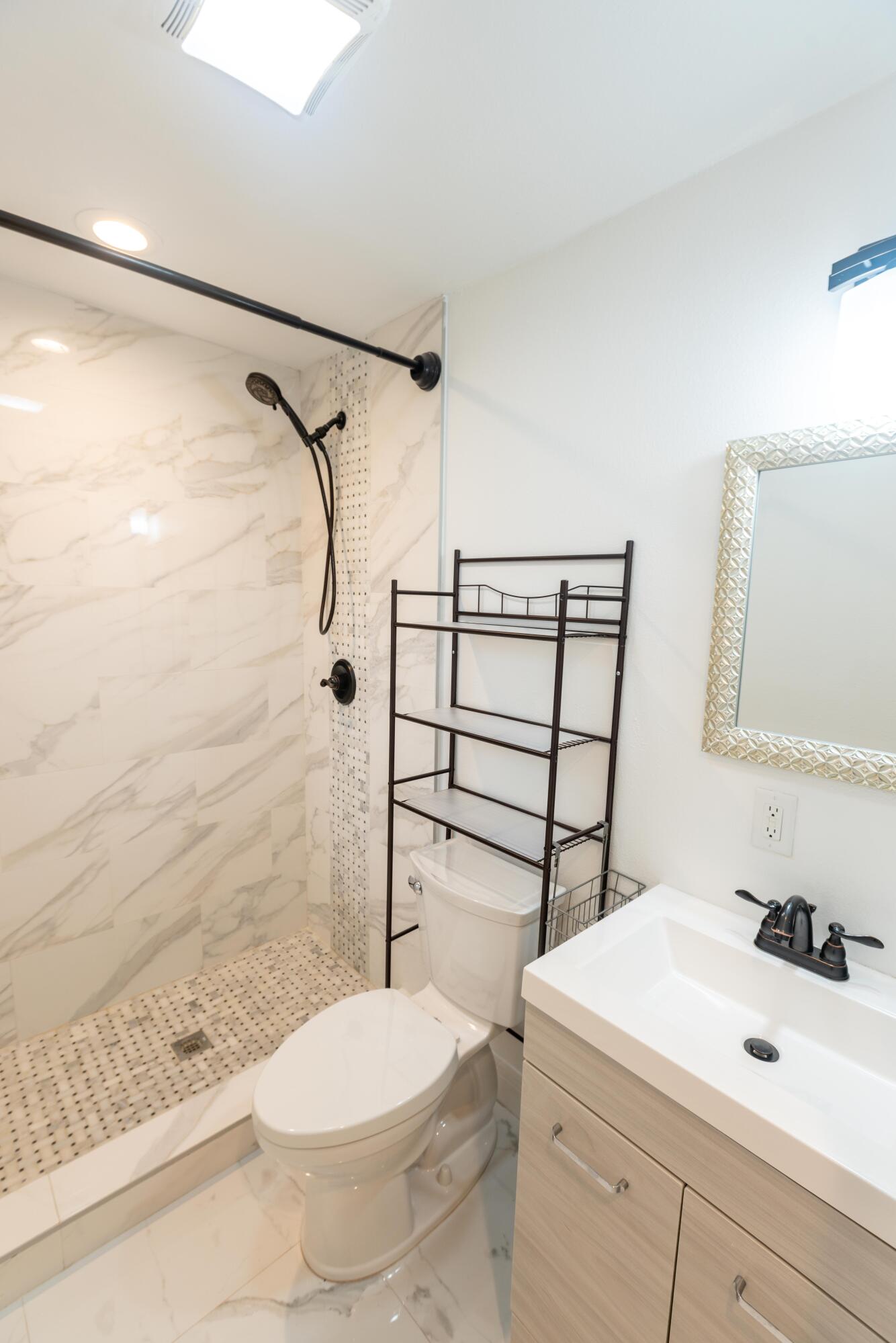 11 Judy Place Key Largo, FL 33037 - Photo 11 of 31 a bathroom with a sink a toilet and shower