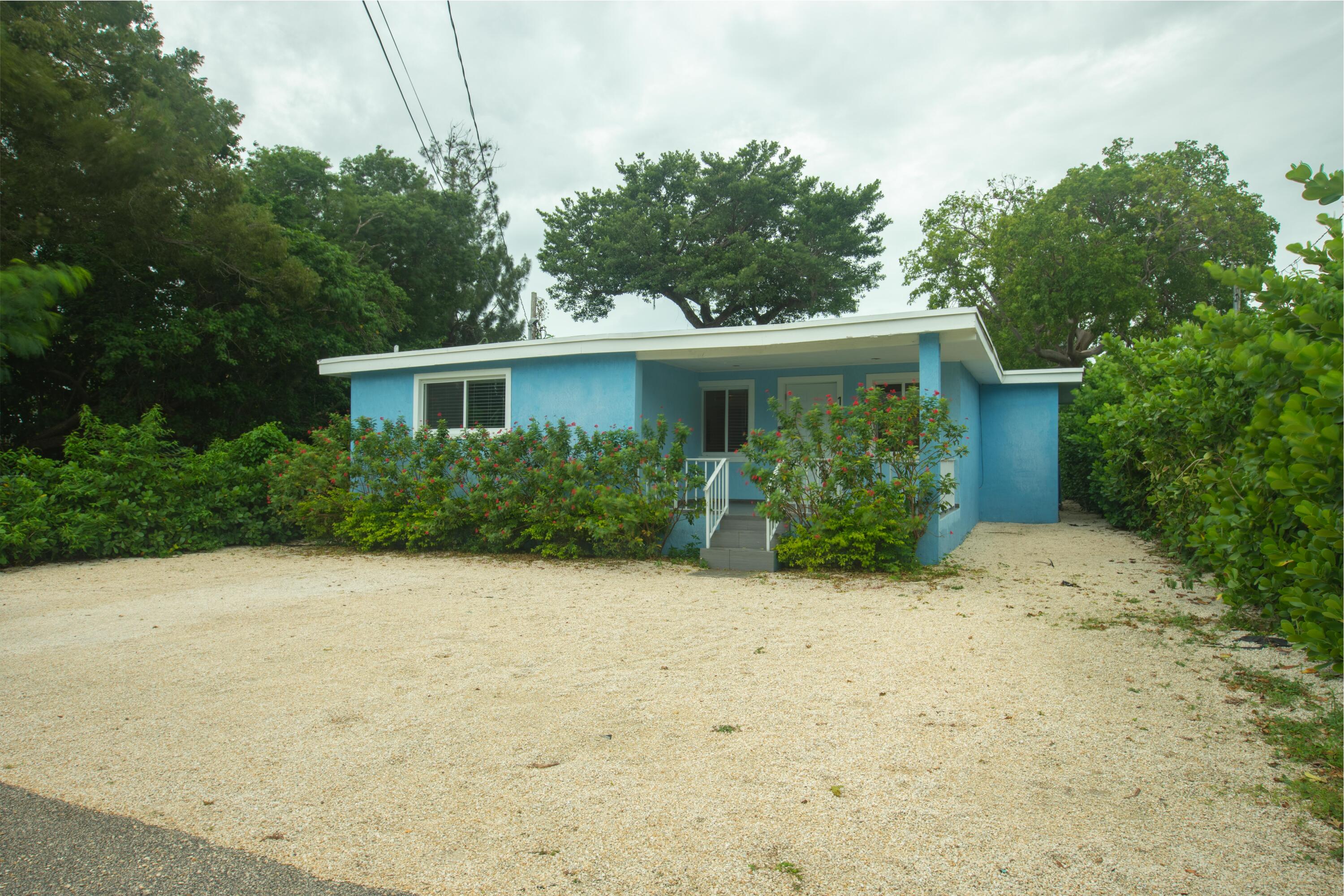 11 Judy Place Key Largo, FL 33037 - Photo 16 of 31 a front view of a house with garden
