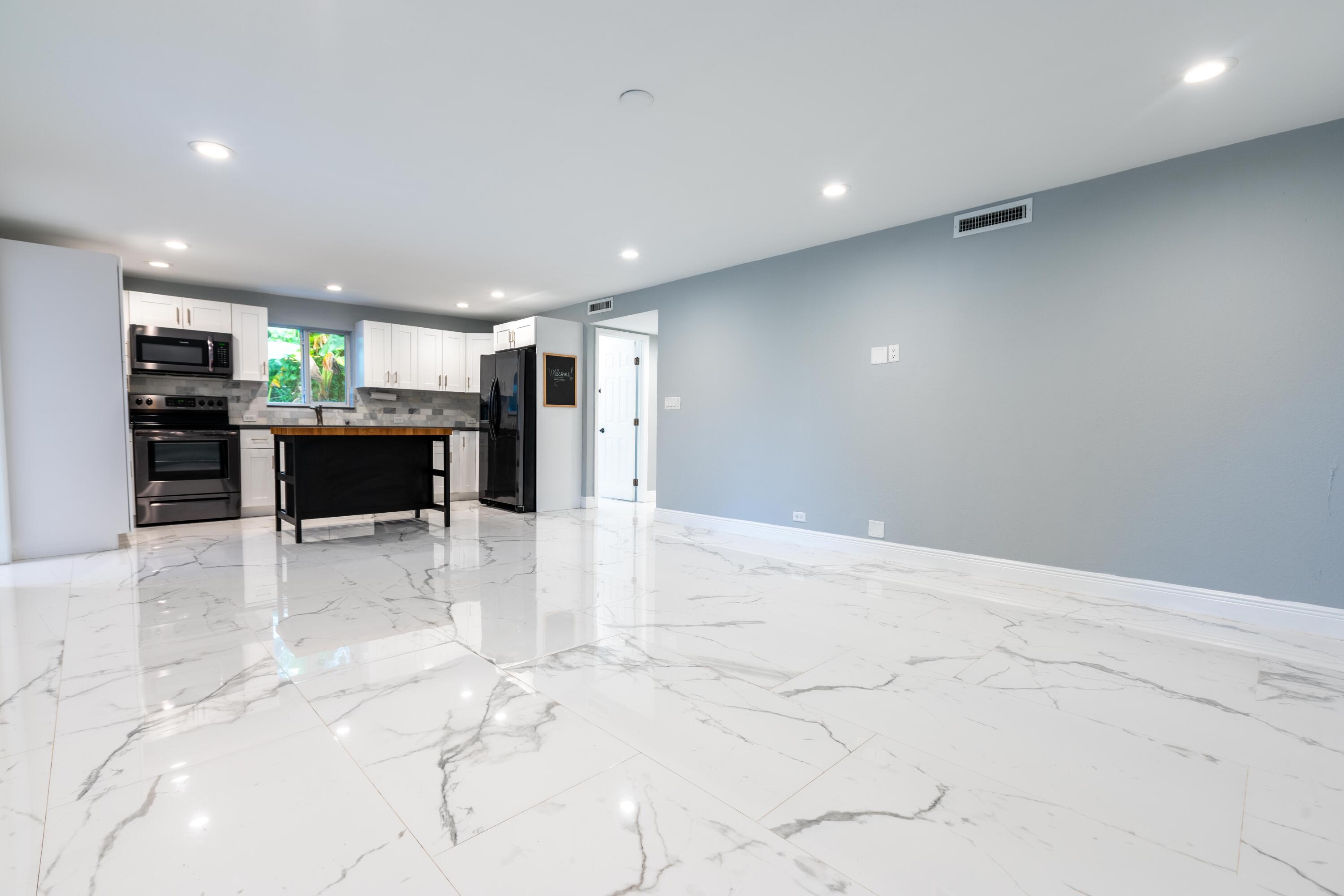 11 Judy Place Key Largo, FL 33037 - Photo 18 of 31 a view of a kitchen with a sink and a refrigerator