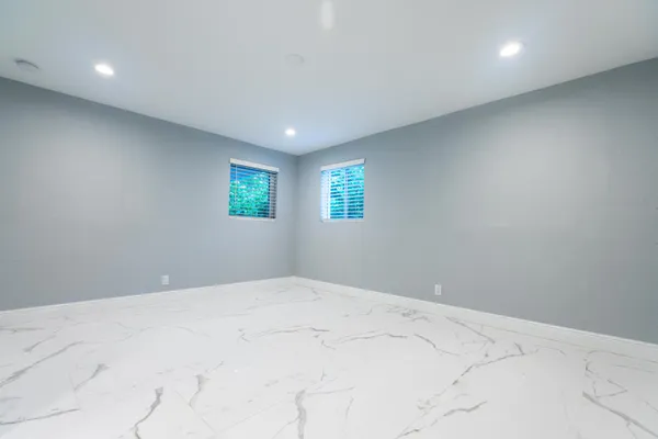 a bathroom with a toilet a sink and shower