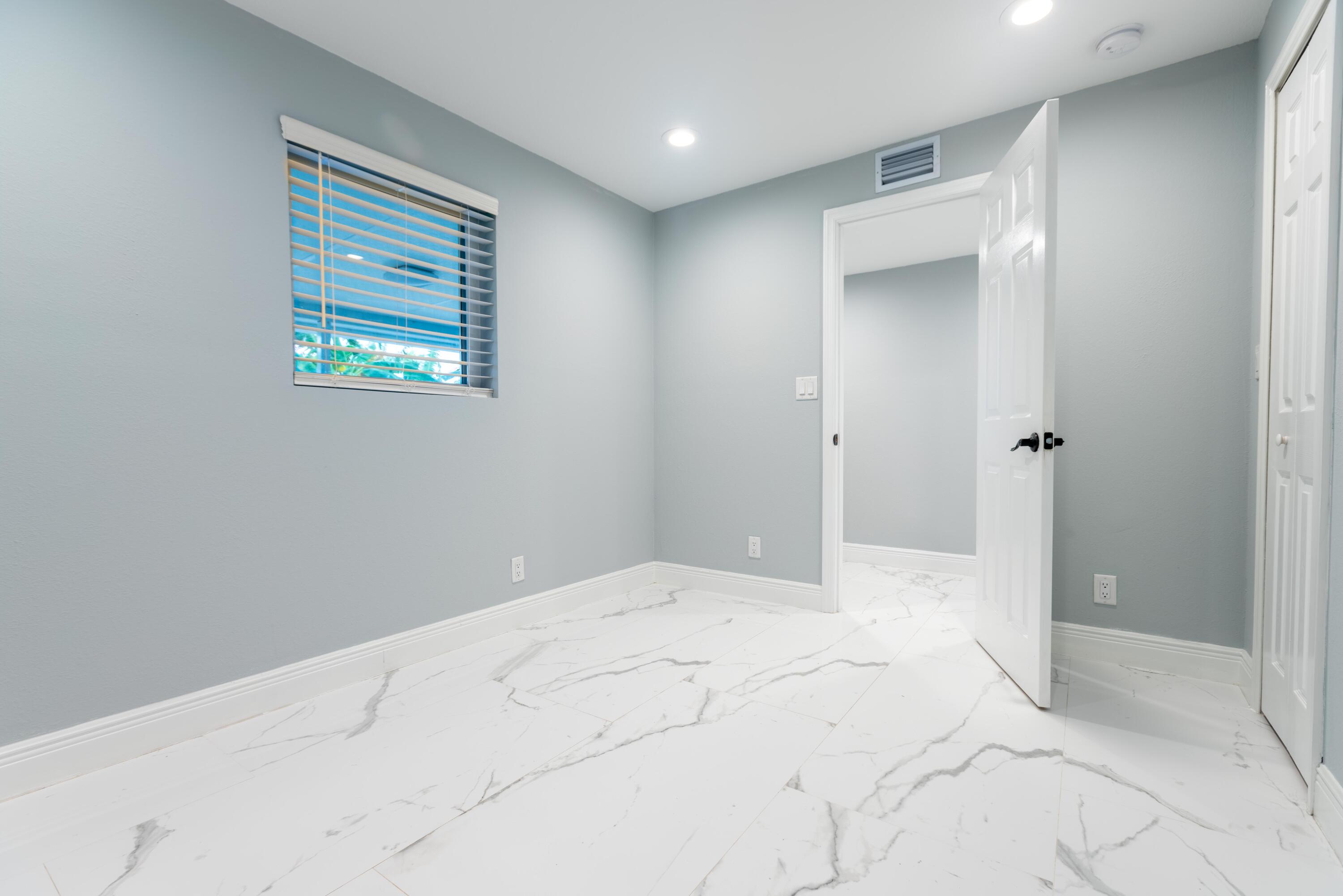 11 Judy Place Key Largo, FL 33037 - Photo 27 of 31 a bathroom with a bathtub and shower