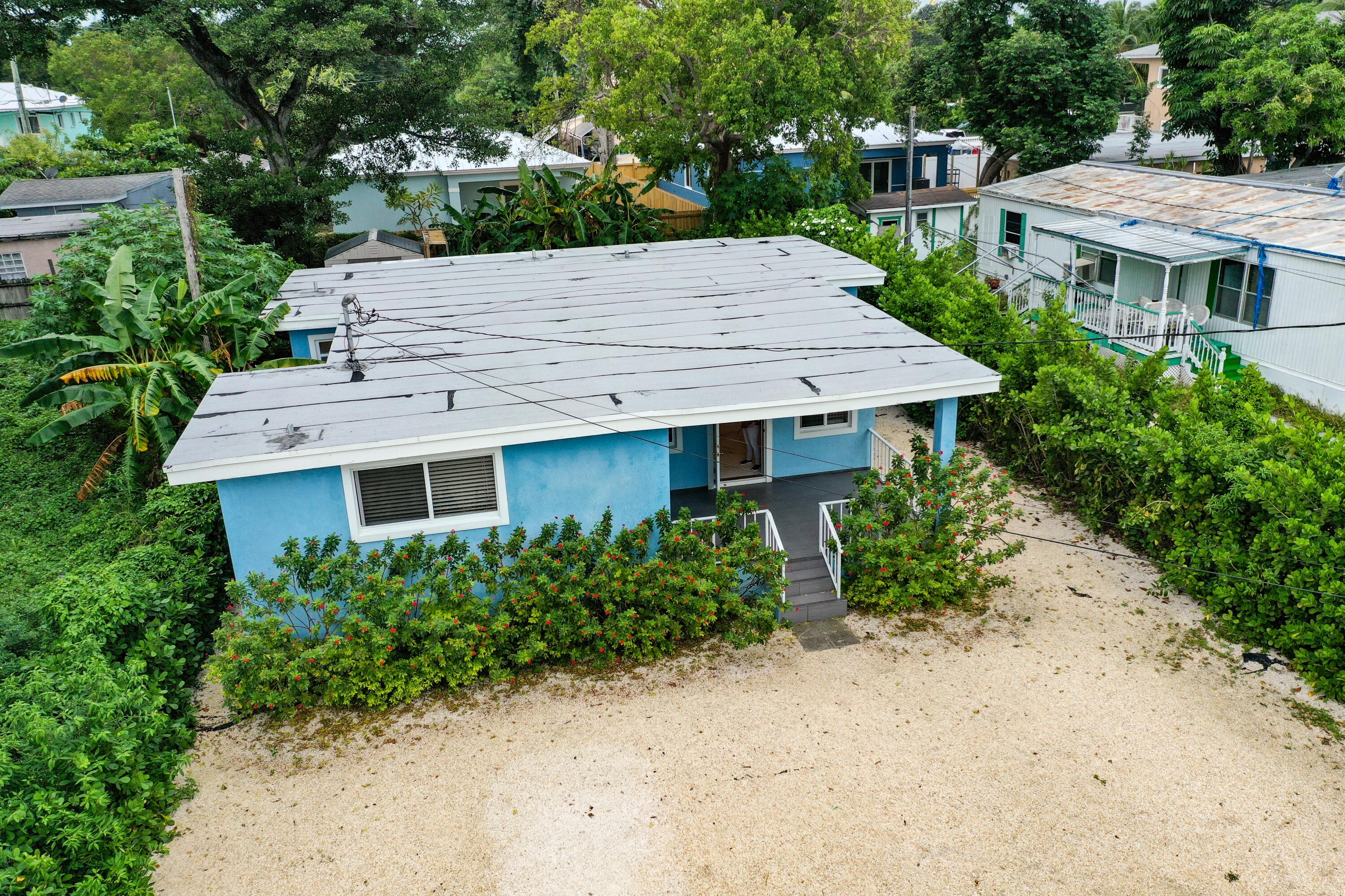 11 Judy Place Key Largo, FL 33037 - Photo 4 of 31 a view of a house with yard and plants