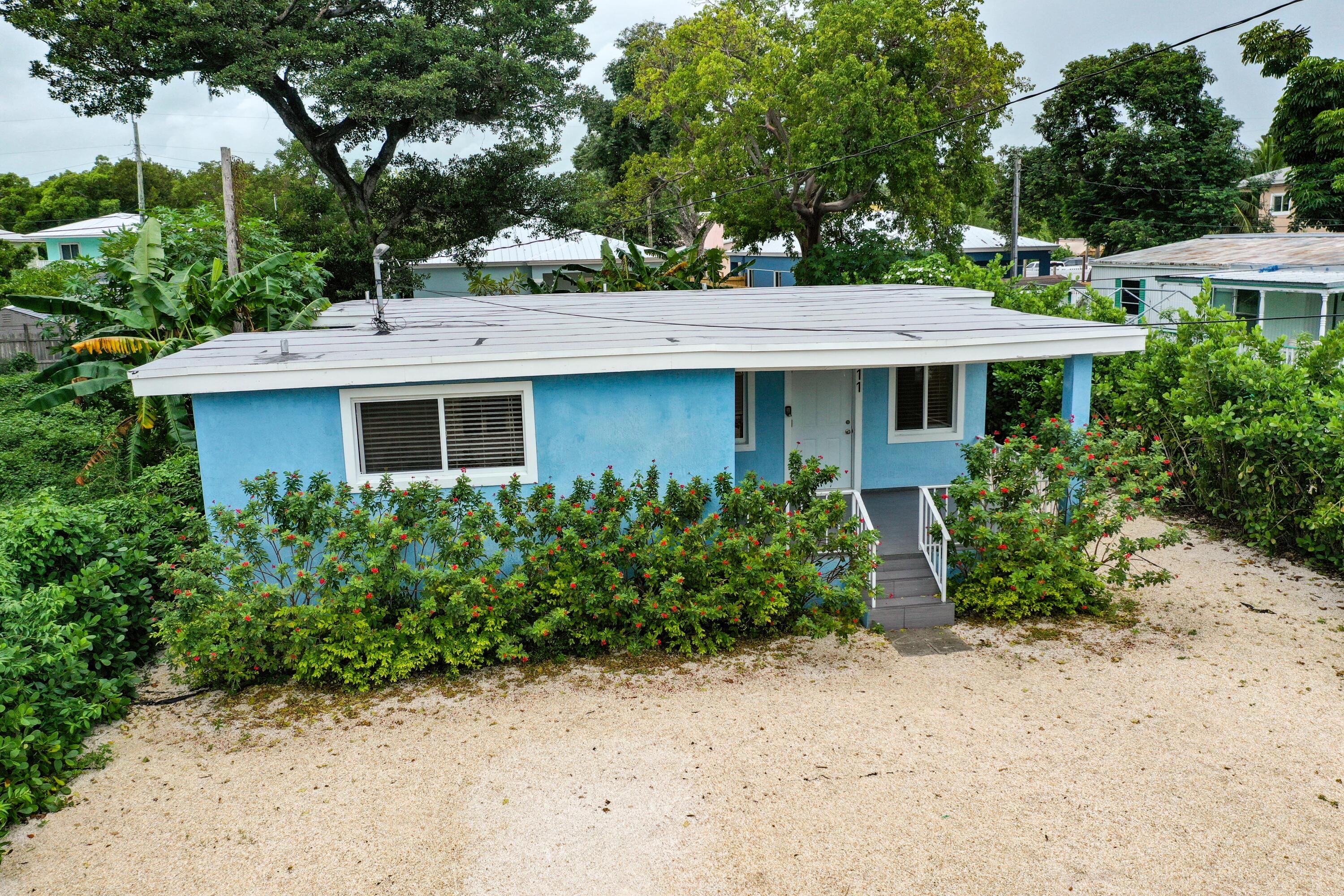 11 Judy Place Key Largo, FL 33037 - Photo 5 of 31 a front view of a house with garden
