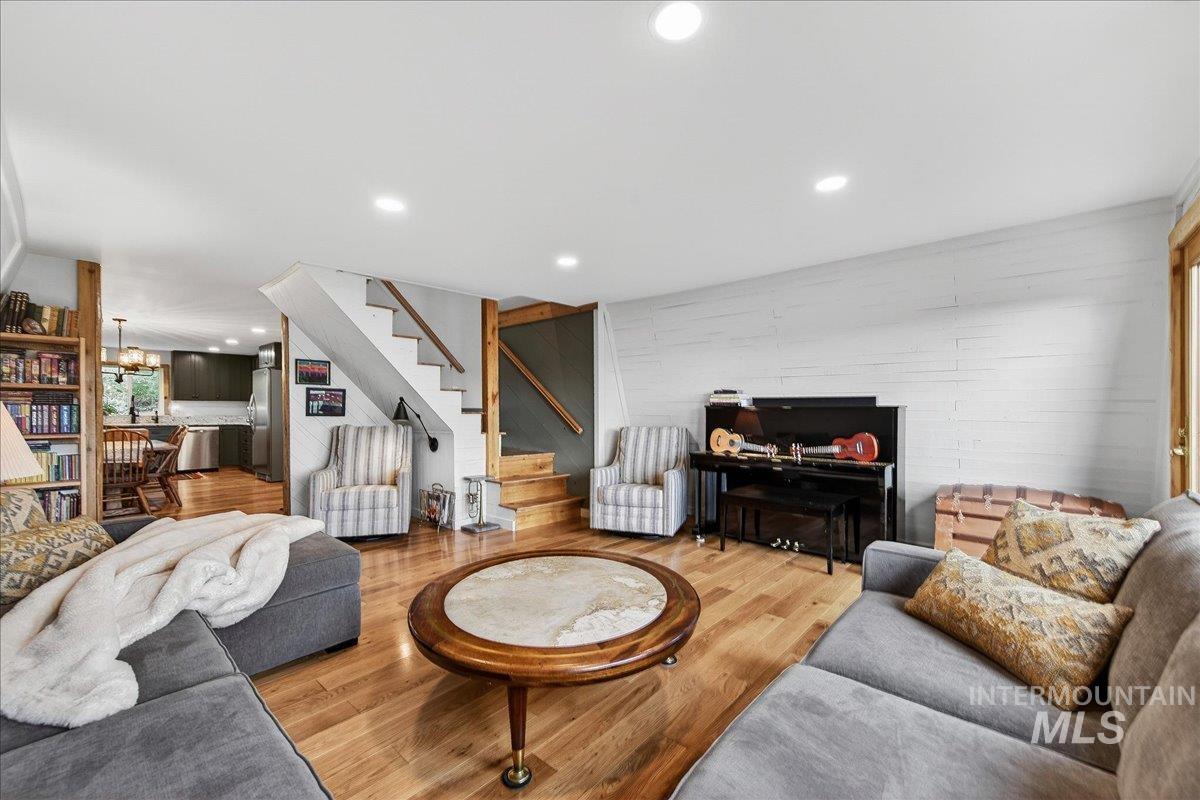 239 Tollgate Road Boise, ID 83716 - Photo 15 of 50 Living area with wood finished floors and suspended lighting