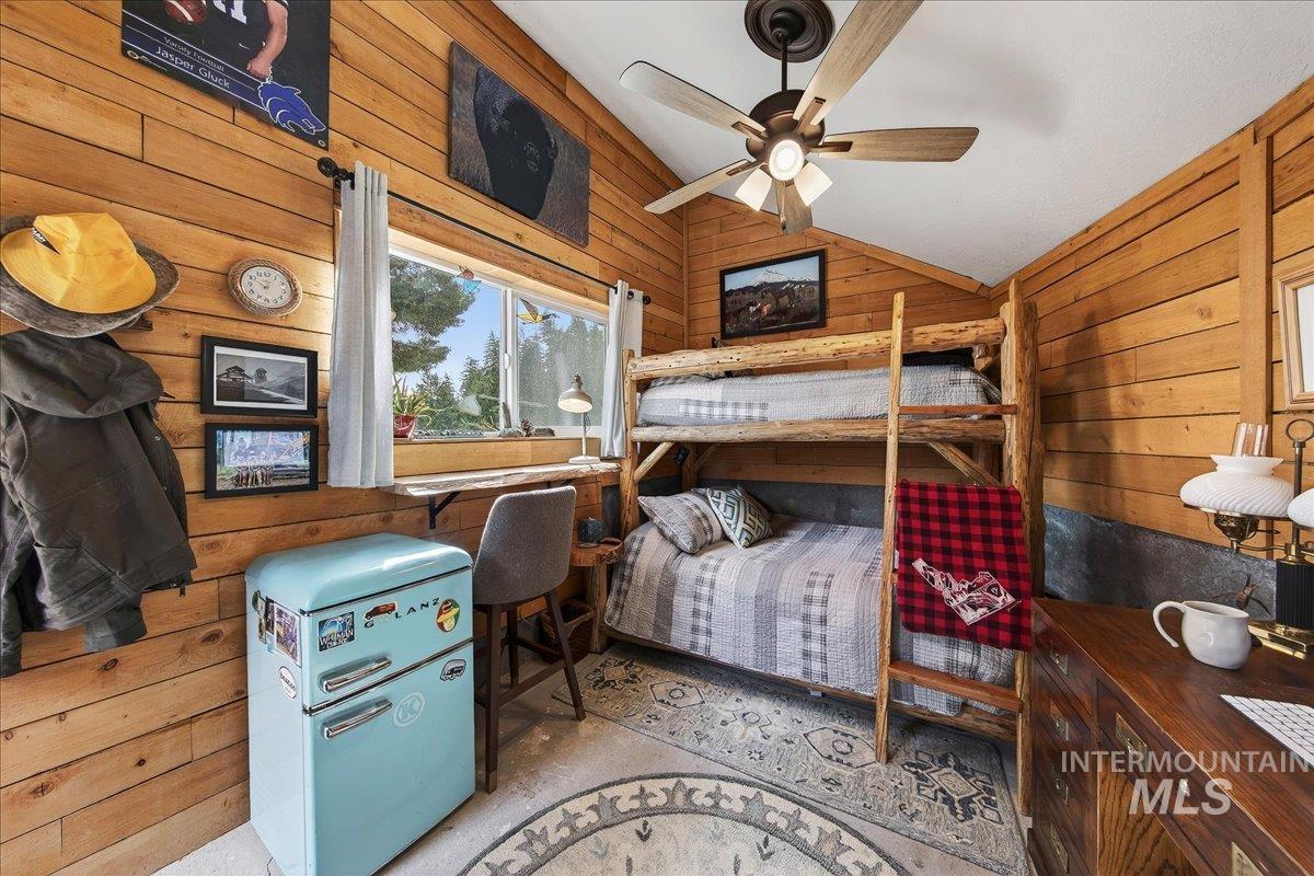 239 Tollgate Road Boise, ID 83716 - Photo 36 of 50 Bunkhouse featuring wood walls, ceiling fan, and lofted ceiling