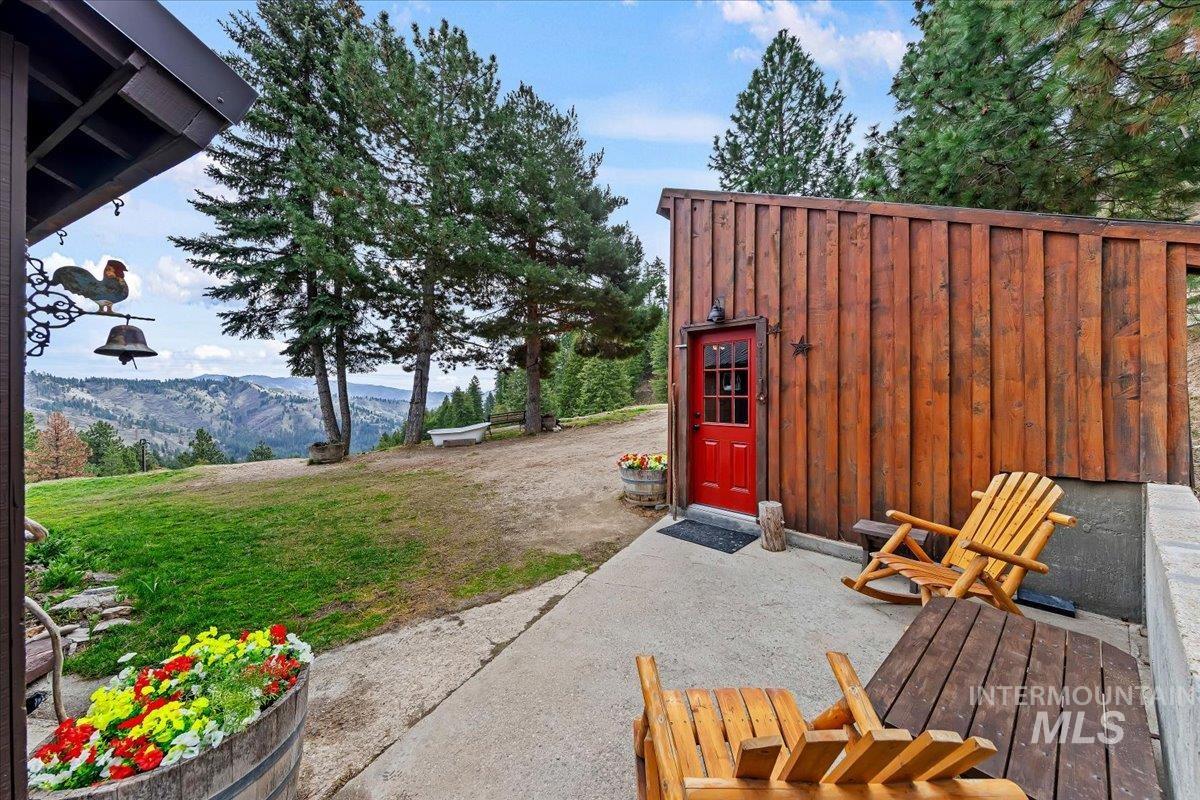239 Tollgate Road Boise, ID 83716 - Photo 39 of 50 View of green lawn with a mountain view and a patio area