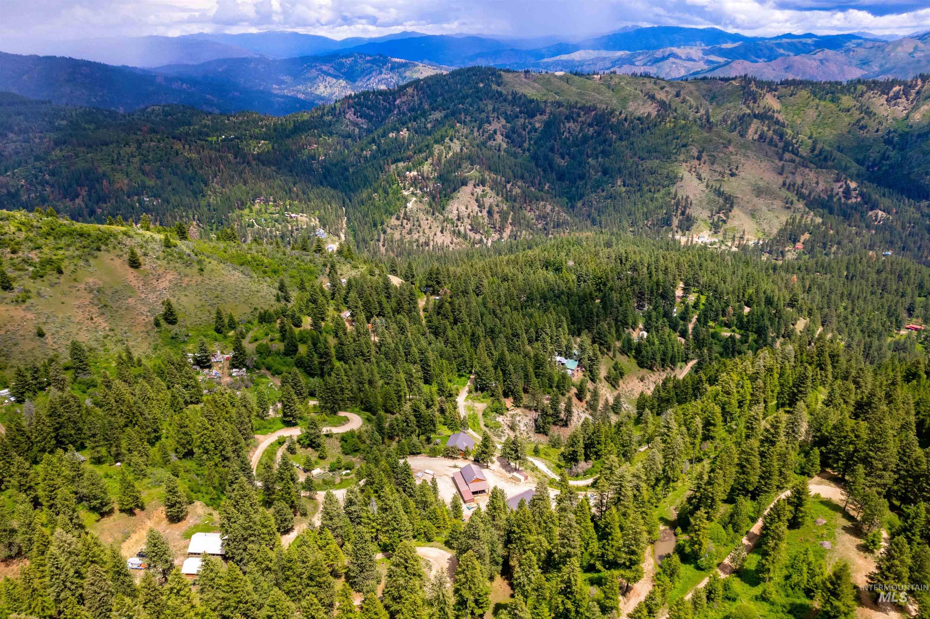 239 Tollgate Road Boise, ID 83716 - Photo 4 of 50 Drone / aerial view of a mountain backdrop and a forest