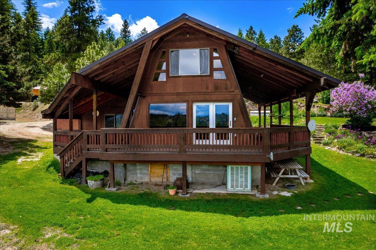 239 Tollgate Road Boise, ID 83716 - Photo 46 of 50 Rear view of property featuring a deck and a lawn