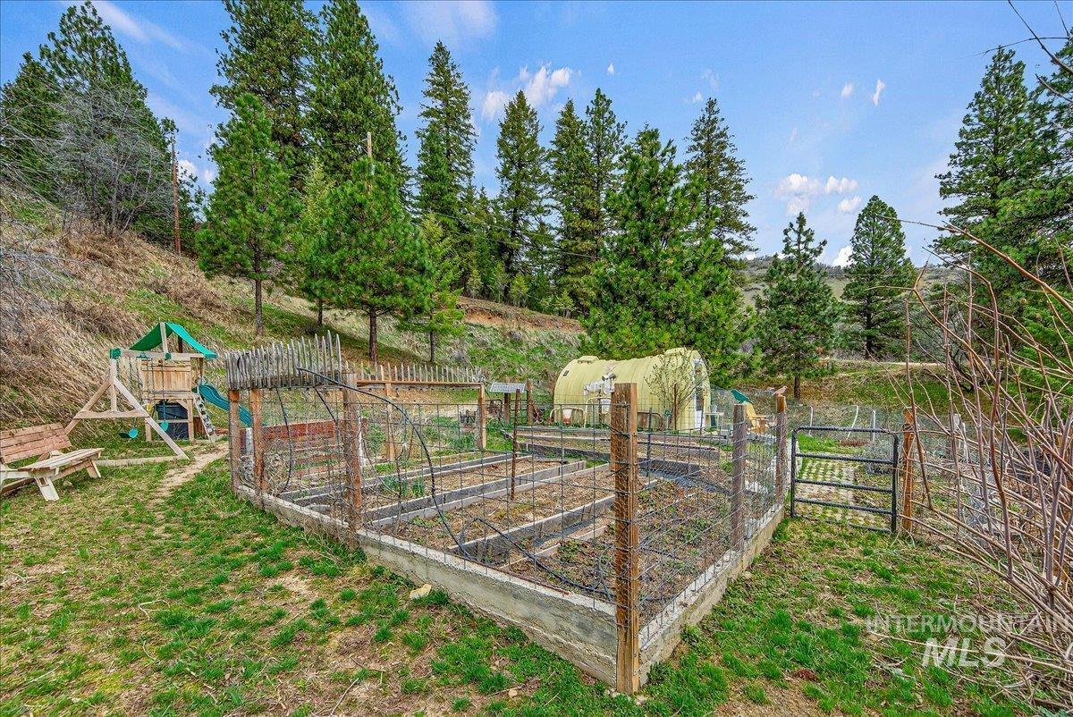 239 Tollgate Road Boise, ID 83716 - Photo 48 of 50 View of yard featuring a vegetable garden and a playground